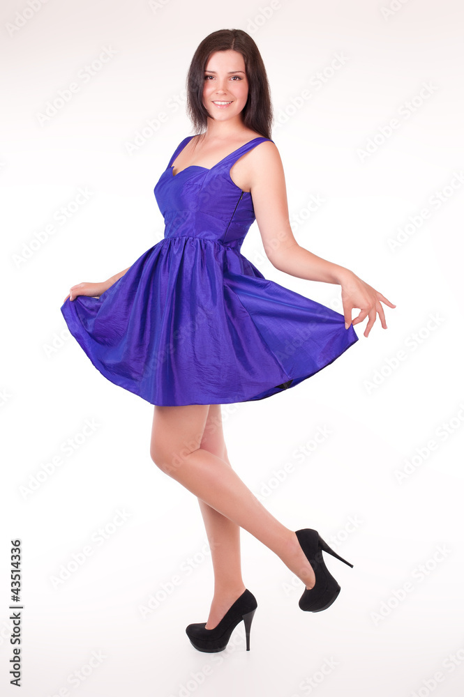 Naklejka premium Beautiful young woman wearing a sexy violet evening dress