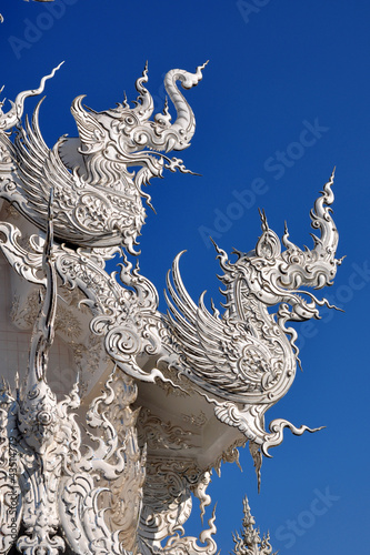 animal sculptures on roof at wat rong khun