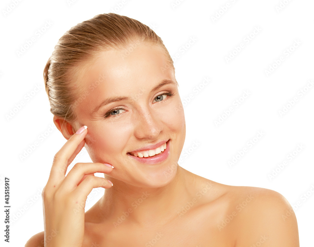 Young woman touching her face isolated on whire background