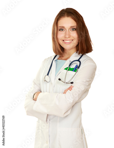 Happy young nurse standing with folded arms