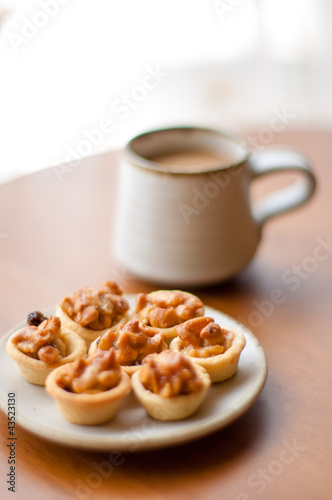 Cashew tart with cup of coffee