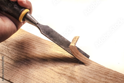 Carpenter working with chisel,isolated photo