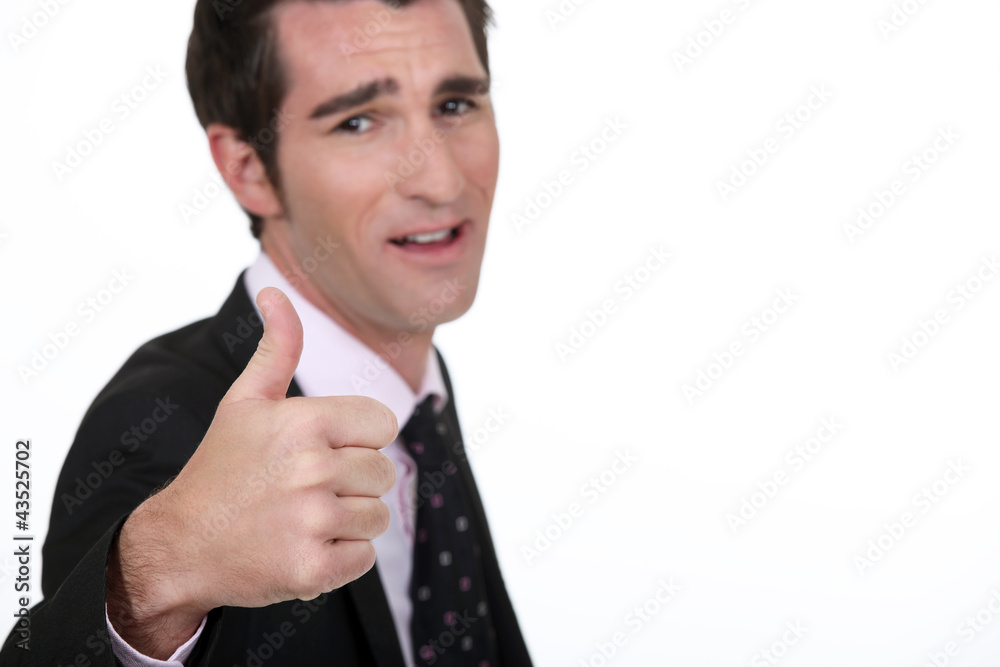 Businessman giving thumbs-up