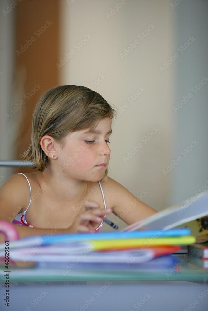 Young girl working on her homework Young girl working on her homework