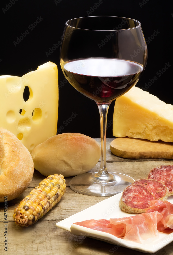 selection of dairy product, salami, Parma ham and red wine selection of dairy product, salami, Parma ham and red wine