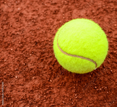 Tennis ball on a tennis clay court © irishmaster