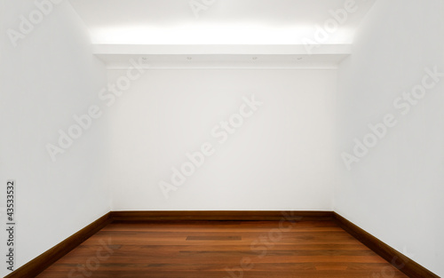 Empty white room with wooden floor