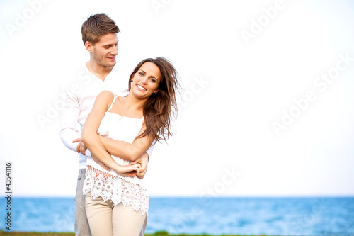 Attractive Couple Enjoying the Windy Beach © Jacob Lund