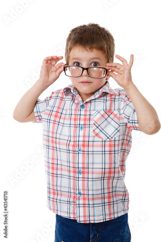 Surprised little boy in glasses