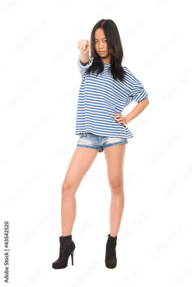 Asian girl in a striped T-shirt pointing against Asian girl in a striped T-shirt pointing against