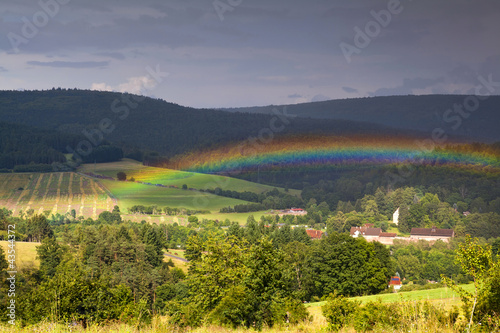 colorful rainbow over mountains