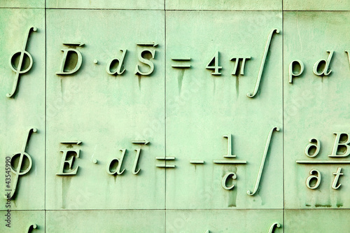 Mathematic language sculpture in Warsaw library wall. Poland