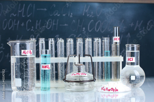 Test-tubes with various acids and other chemicals photo