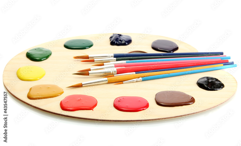 wooden art palette with paint and brushes.isolated on white wooden art palette with paint and brushes.isolated on white