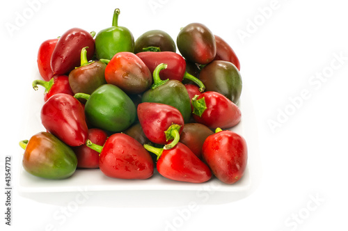 Cherry peppers on white plate