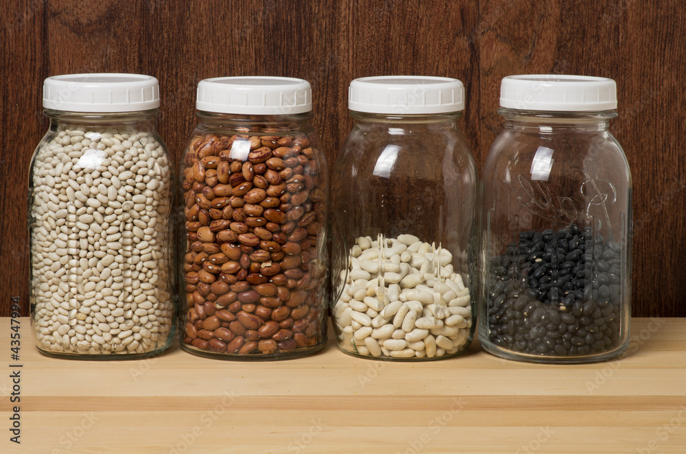 Beans in glass canisters in a kitchen Beans in glass canisters in a kitchen