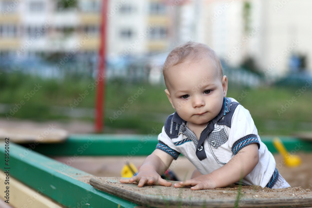 Portrait of child in sandbox Portrait of child in sandbox