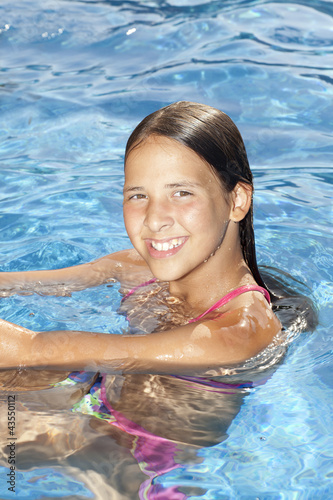 smiling girl in the swimming pool