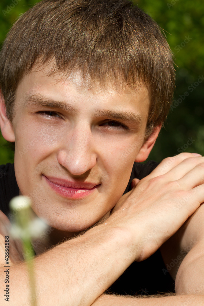 Portrait of a handsome young man posing outdoor. Portrait of a handsome young man posing outdoor.