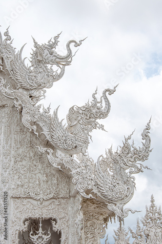 Decoration with white elephant and dragon on roof. © xiebiyun