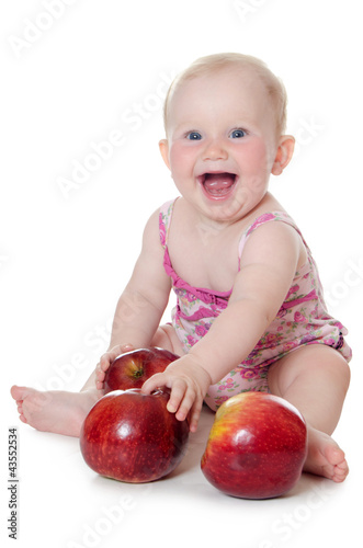 The little baby with red apples