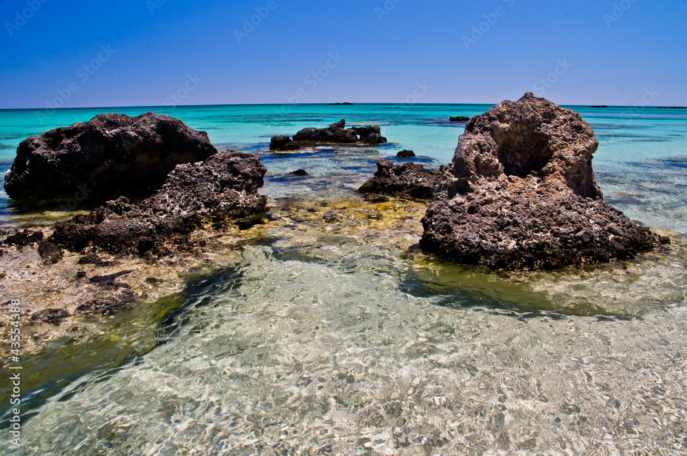 Black rocks and turquoise water