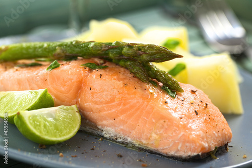 Baked salmon fillet with asparagus, lime and potatoes
