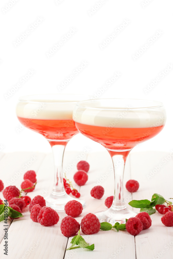 fruit jelly with berries in glasses on wooden table fruit jelly with berries in glasses on wooden table
