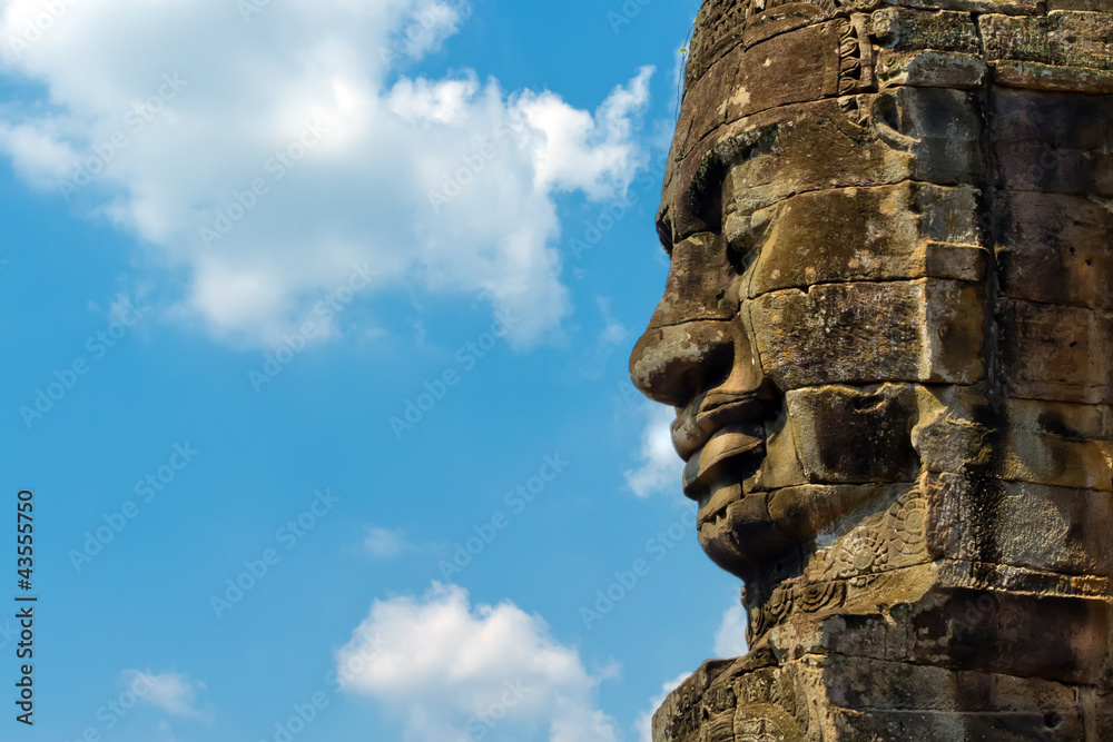 Angkor Face against blue sky, Angkor Thom, Cambodia