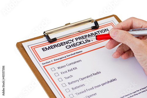 Hand completing Emergency Preparation List