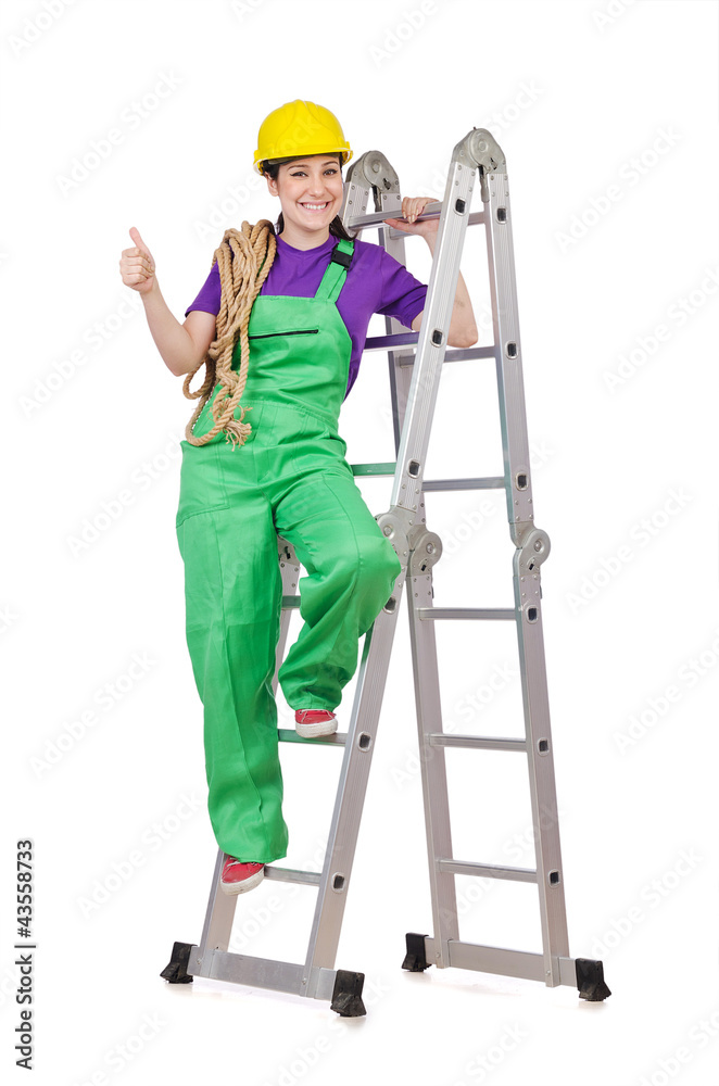 Woman worker standing on ladder Woman worker standing on ladder