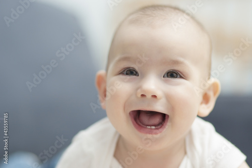 smiling happy infant boy