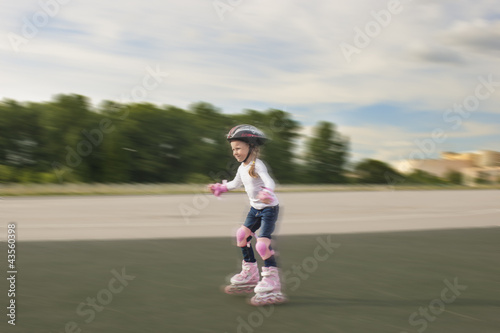 lovely portrait of small little caucasian girl skating © danmorgan12