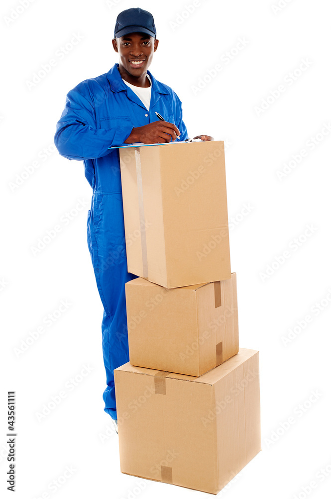 Cheerful delivery guy preparing receiving notice Cheerful delivery guy preparing receiving notice