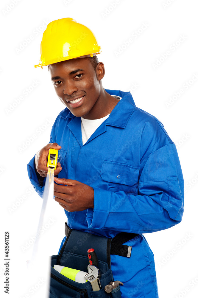 Portrait of african repairman with measuring tape Portrait of african repairman with measuring tape
