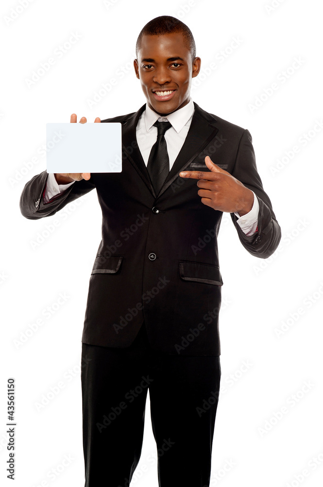 Business promoter pointing at blank placard Business promoter pointing at blank placard