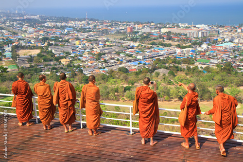 Group monk standing on the view point of HuaHin mountain