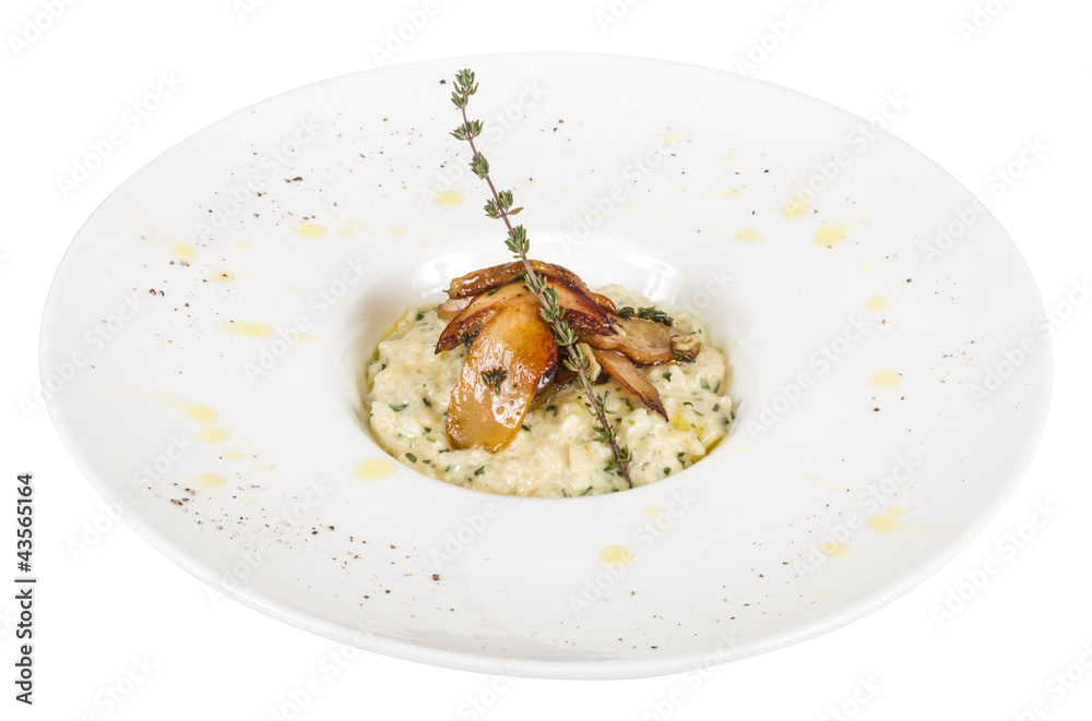 photo of delicious risotto dish with herbs and mushrooms on whit