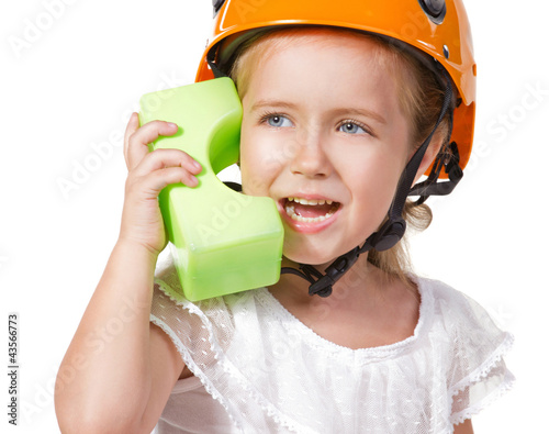 little girl playing with block