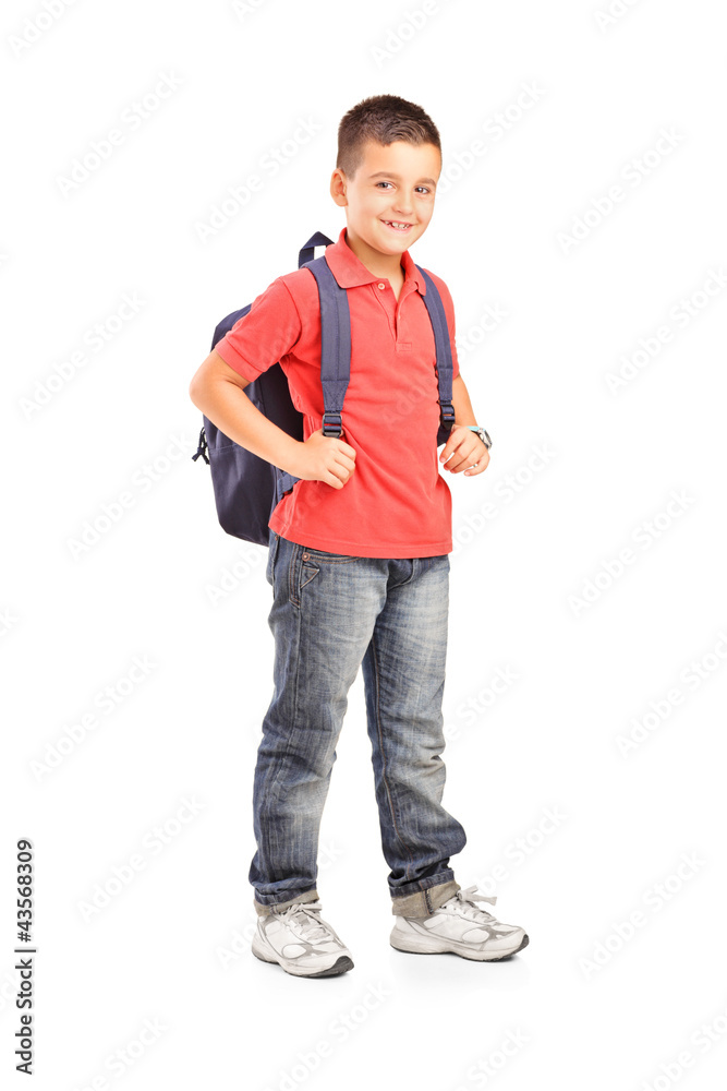 Fototapeta premium Full length portrait of a school boy with backpack