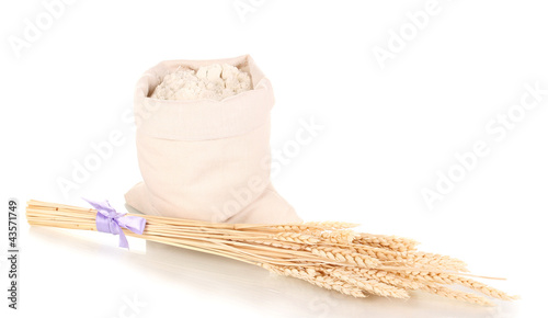 Flour and wheat grain isolated on white