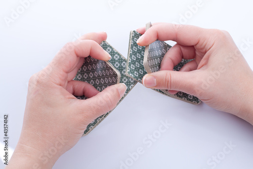 Woman dealing playing cards.