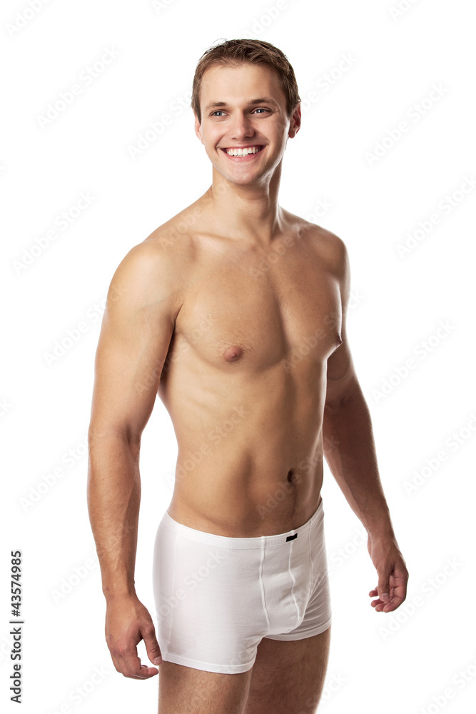 Handsome young man in underwear against white Handsome young man in underwear against white