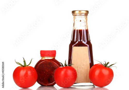 Tomato sauce in bottles isolated on white