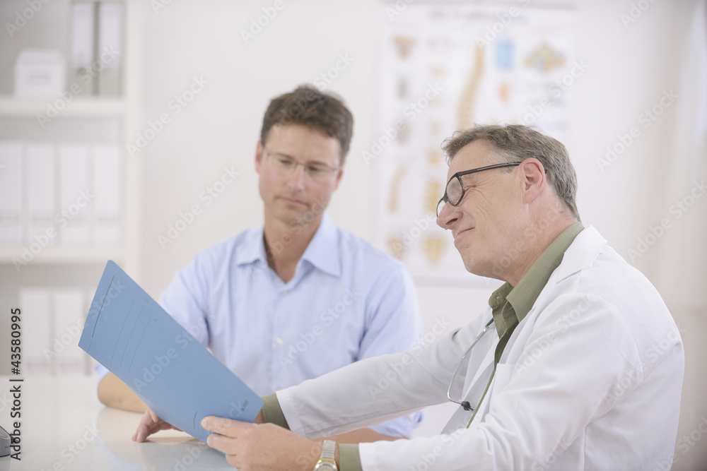 Doctor and patient discussing blood-test results Doctor and patient discussing blood-test results