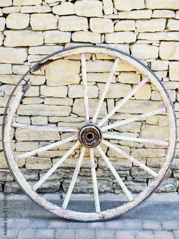 Old Vintage broken wood wheel in Provence, traditional wall back