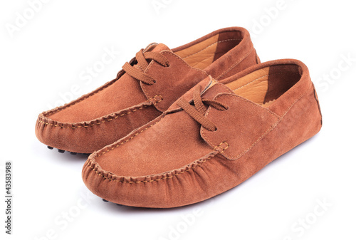 Pair of brown male moccasins over white background