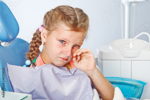 Crying girl at the dentist