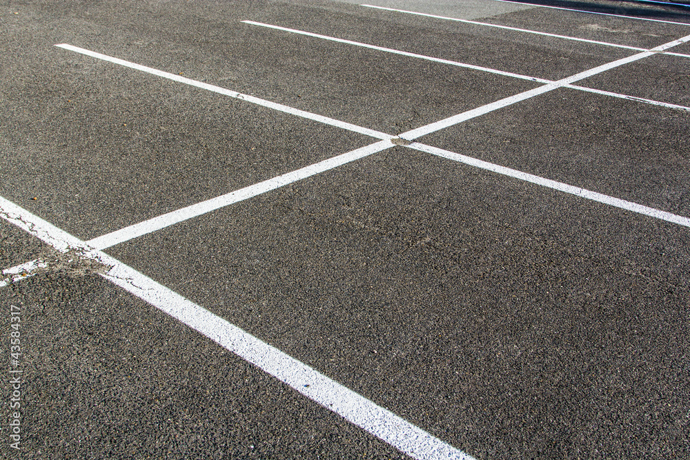lines for parking lotzs drawn on the asphalt