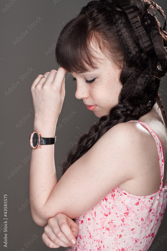 beautiful pensive girl with eyes closed and hand